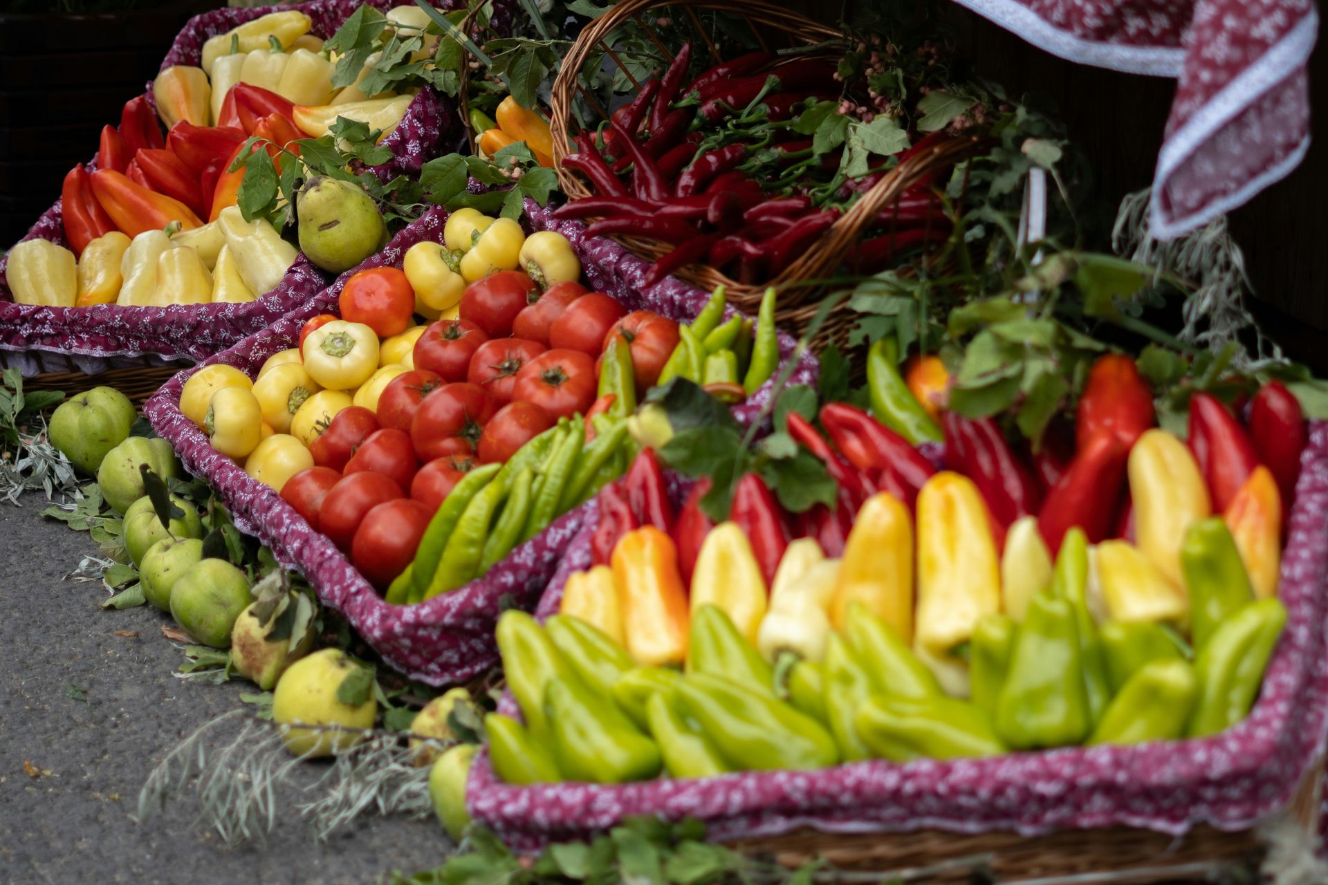 Baskets overflowing with colorful fresh vegetables and fruits